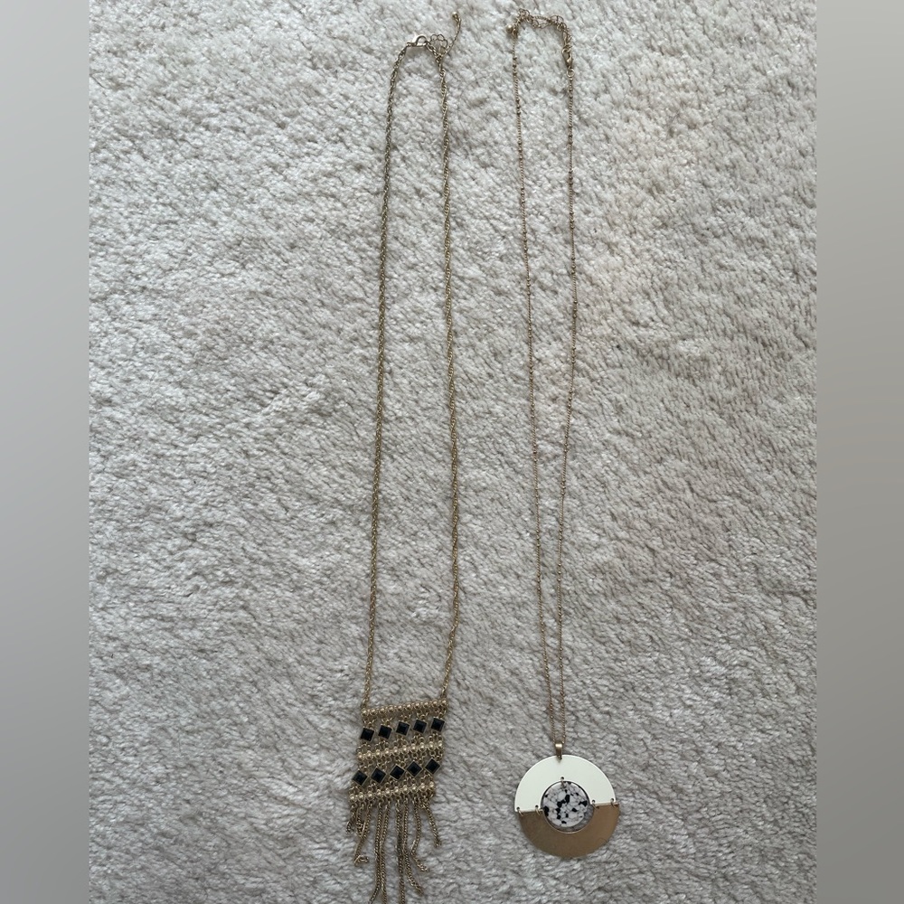 Two gold geometric necklaces